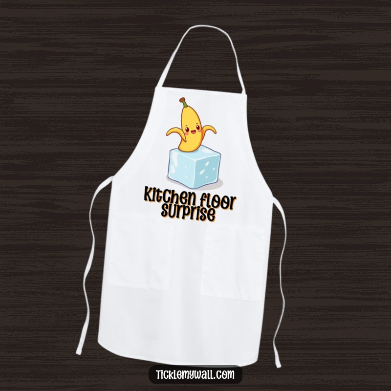 Funny apron print of a banana peel comically slipping on a small ice cube, perfect for adding humor to cooking.