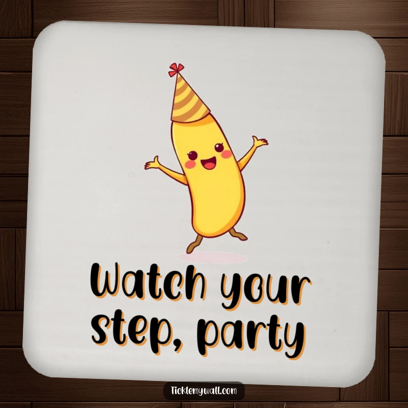 Funny dancing banana wearing a party hat slipping on its own peel on a protective drink coaster.