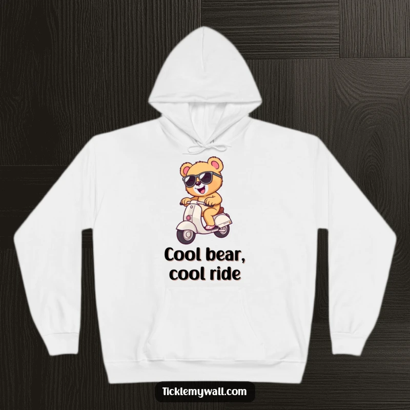 Funny teddy bear in sunglasses on a tiny scooter, cozy hooded sweatshirt, perfect for gifting and casual wear.