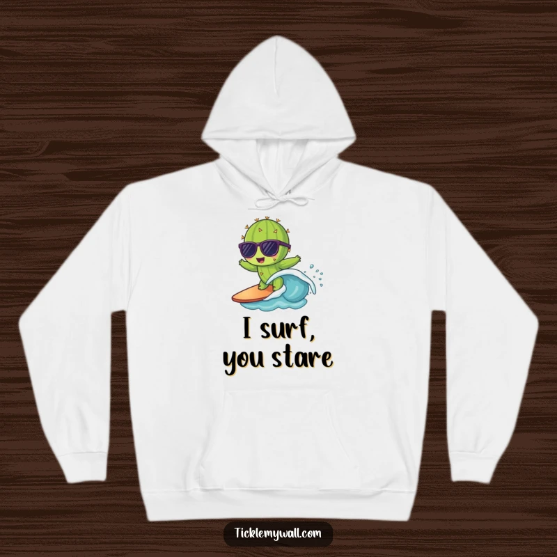 Funny hoodie featuring a sunglasses-wearing cactus bravely surfing a small wave, a warm and comical apparel choice.