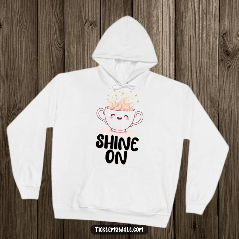 Funny teacup hoodie, soft sweatshirt featuring a teacup overflowing with glitter, spilling gleefully, cozy sparkle.