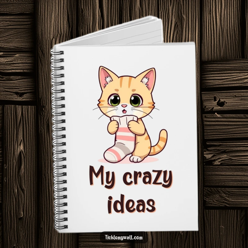 Funny notebook with a surprised cat hilariously attempting to wear a sock, perfect for journaling and note-taking with humor.