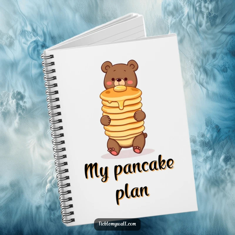 Funny notebook cover with a clumsy bear character comically balancing a wobbly stack of three pancakes. For notes, doodles, and breakfast lovers.