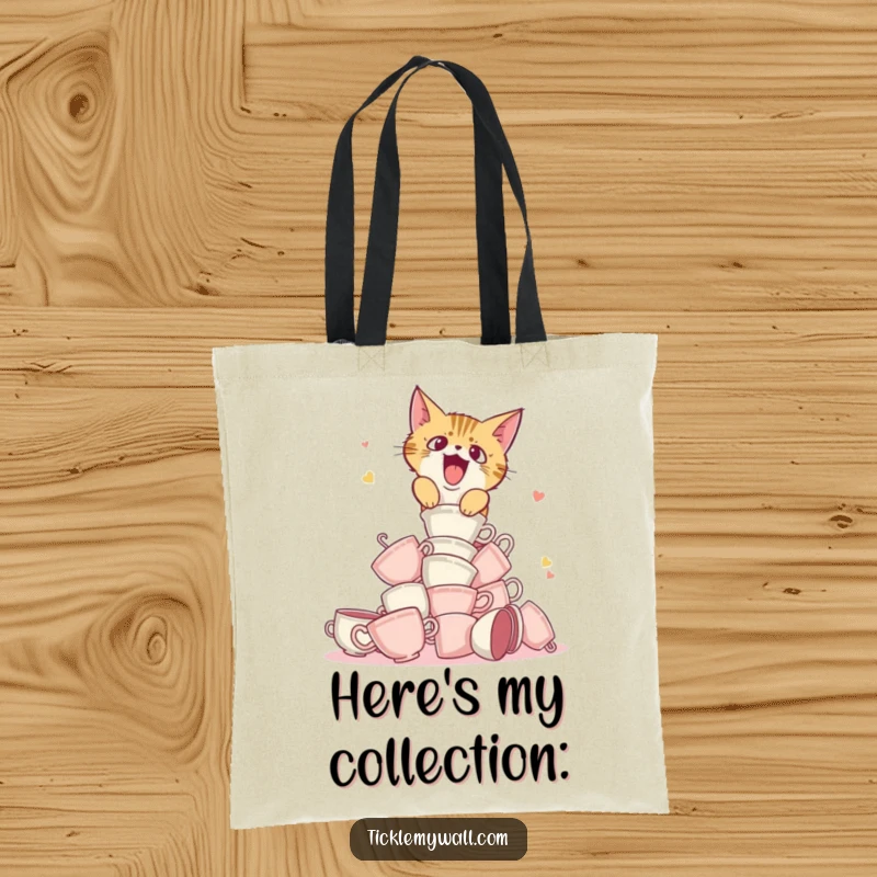 Funny tote bag illustrating a startled cat knocking over a tower of teacups, practical and amusing.